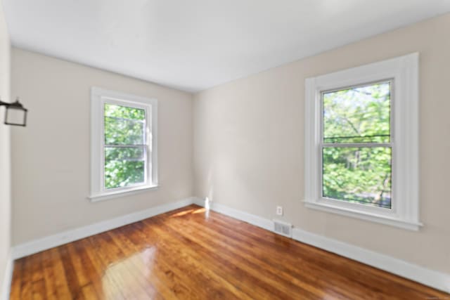 38 Ford St, New Haven, CT 06511 - spare room featuring baseboards and wood finished floors