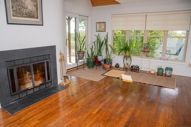 58 Quarry Dock Rd Unit 58, Branford, CT 06405 - workout area with wood finished floors and a fireplace with flush hearth