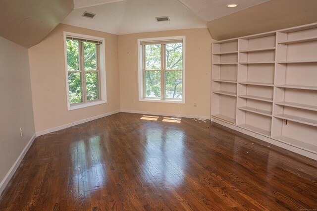 58 Quarry Dock Rd Unit 58, Branford, CT 06405 - spare room with dark wood-style flooring, baseboards, and vaulted ceiling