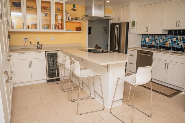58 Quarry Dock Rd Unit 58, Branford, CT 06405 - kitchen featuring wine cooler, appliances with stainless steel finishes, island exhaust hood, a sink, and a peninsula