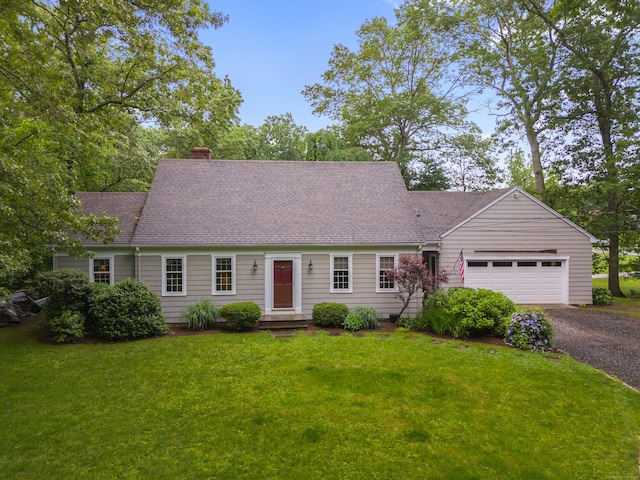 57 Elm Ridge Rd, Stonington, CT 06379 - view of front of property featuring asphalt driveway, an attached garage, a front yard, and a chimney