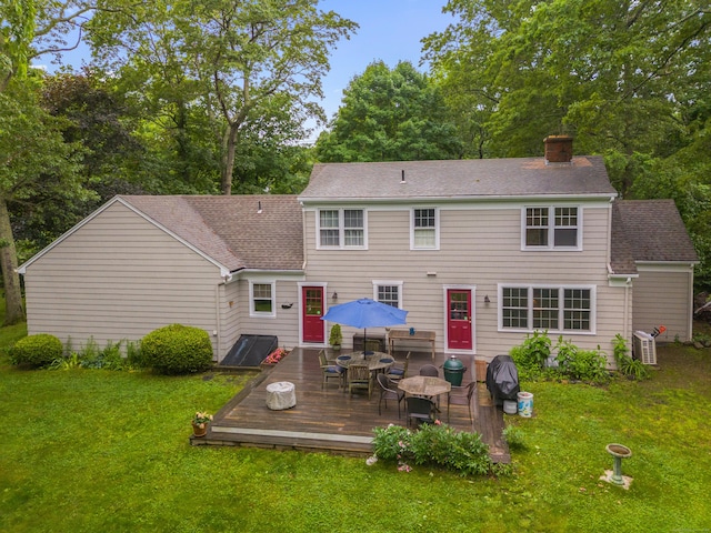 57 Elm Ridge Rd, Stonington, CT 06379 - back of property with a deck, a chimney, a lawn, and outdoor dining area