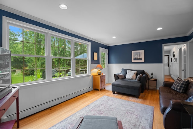57 Elm Ridge Rd, Stonington, CT 06379 - living room with baseboard heating, ornamental molding, wood finished floors, and wainscoting
