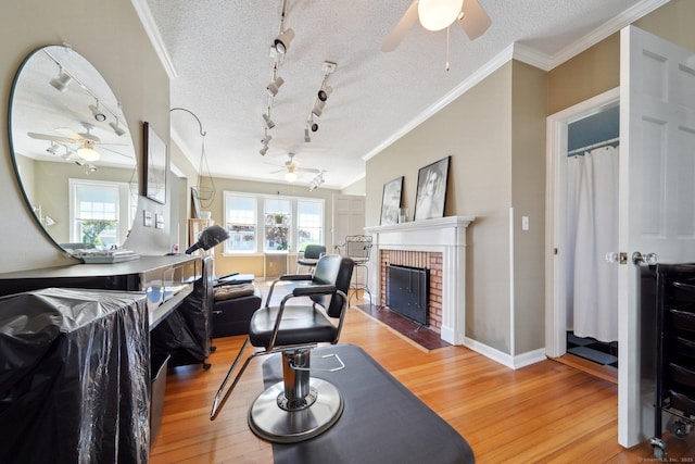189 E Ave, Norwalk, CT 06855 - living area with a ceiling fan, light wood finished floors, rail lighting, and a textured ceiling