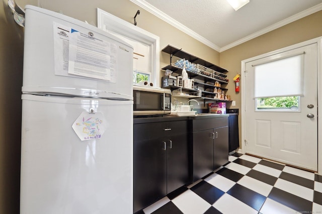 189 E Ave, Norwalk, CT 06855 - kitchen with freestanding refrigerator, dark floors, stainless steel microwave, ornamental molding, and open shelves