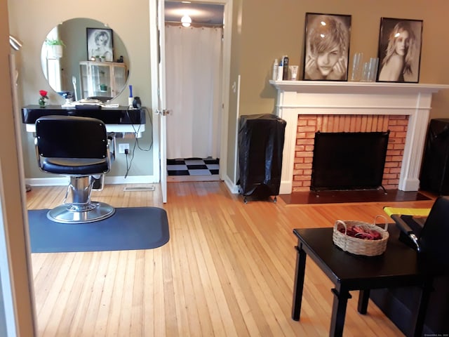 189 E Ave, Norwalk, CT 06855 - living room with a brick fireplace and wood finished floors