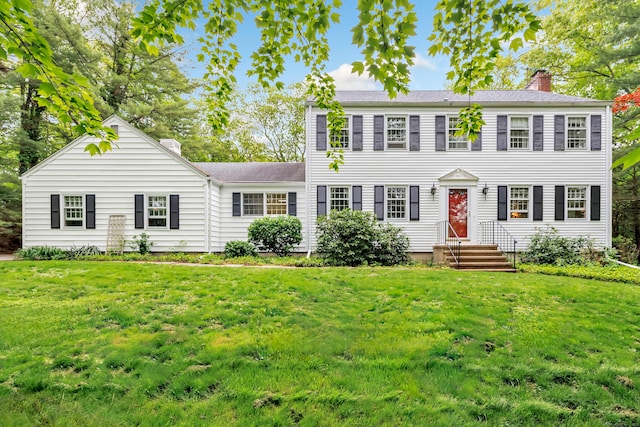 73 Golden Hill St, Trumbull, CT 06611 - colonial house with a chimney, entry steps, and a front lawn