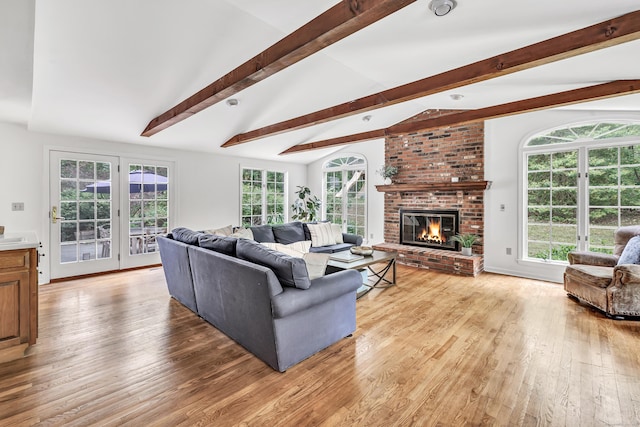 73 Golden Hill St, Trumbull, CT 06611 - living area with light wood-style flooring and a brick fireplace