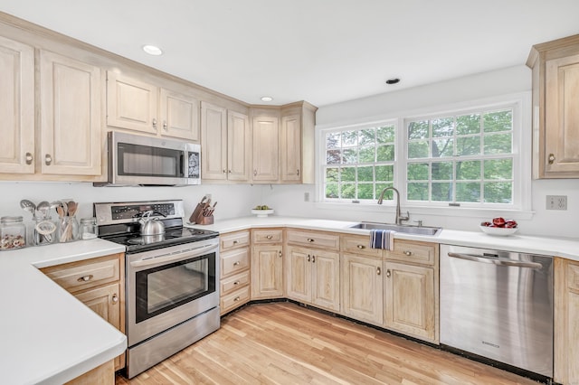73 Golden Hill St, Trumbull, CT 06611 - kitchen featuring stainless steel appliances, a sink, light brown cabinets, light countertops, and recessed lighting