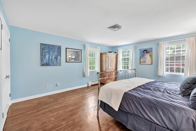 73 Golden Hill St, Trumbull, CT 06611 - bedroom featuring wood finished floors, multiple windows, and baseboards
