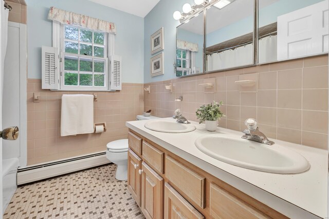 73 Golden Hill St, Trumbull, CT 06611 - full bath with a baseboard radiator, toilet, tile walls, wainscoting, and curtained shower