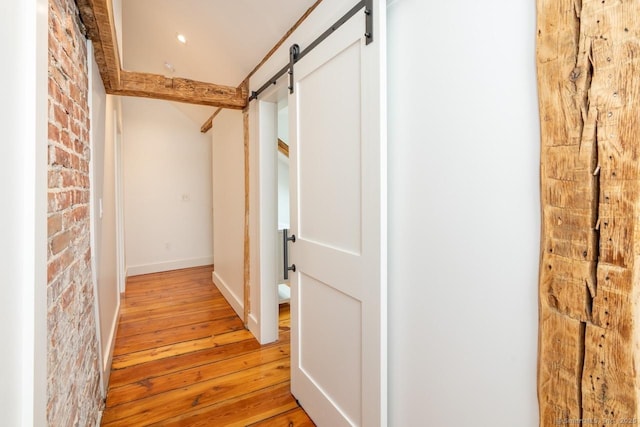 99 Sharon Mountain Rd, Sharon, CT 06069 - corridor with a barn door, light wood finished floors, and baseboards