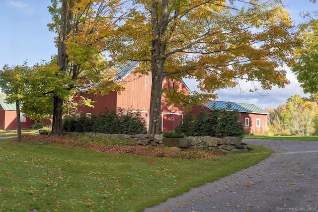 99 Sharon Mountain Rd, Sharon, CT 06069 - view of home's exterior with a yard, metal roof, and asphalt driveway