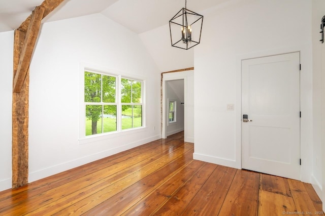 99 Sharon Mountain Rd, Sharon, CT 06069 - empty room featuring a chandelier, vaulted ceiling, wood-type flooring, and baseboards