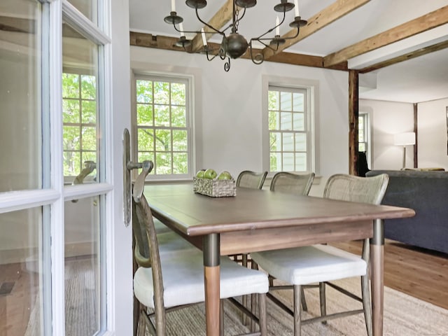 114 Ruscoe Rd, Wilton, CT 06897 - dining space with a chandelier, healthy amount of natural light, and wood finished floors