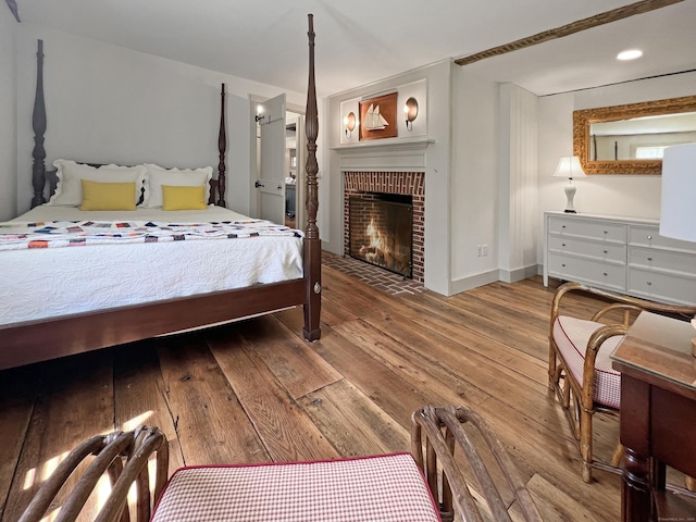 114 Ruscoe Rd, Wilton, CT 06897 - bedroom with hardwood / wood-style flooring, a fireplace, and baseboards