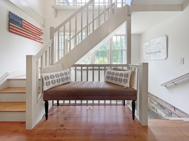114 Ruscoe Rd, Wilton, CT 06897 - staircase featuring wood finished floors and a high ceiling
