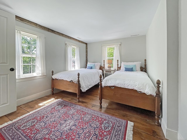 114 Ruscoe Rd, Wilton, CT 06897 - bedroom featuring multiple windows, wood-type flooring, and baseboards