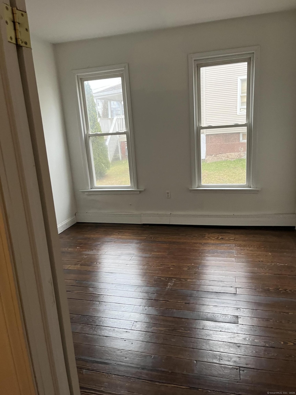 80 Olive St, Meriden, CT 06450 - spare room featuring hardwood / wood-style floors, baseboards, and baseboard heating