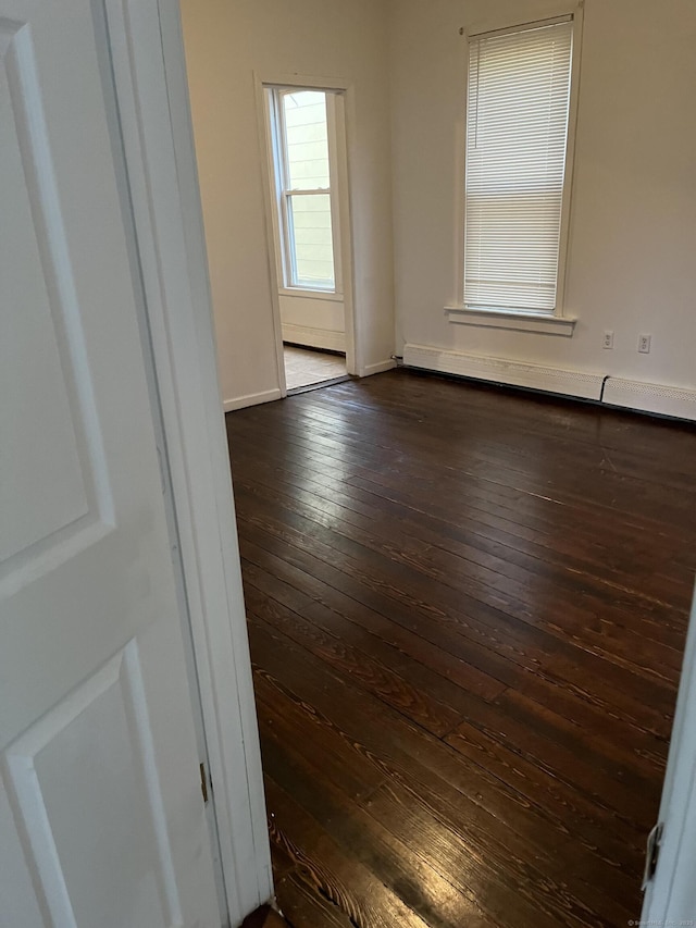 80 Olive St, Meriden, CT 06450 - spare room with dark wood-style flooring and baseboards