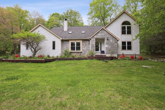 8 Grants Ln, New Milford, CT 06776 - view of front of house with stone siding, a chimney, a front yard, and roof with shingles