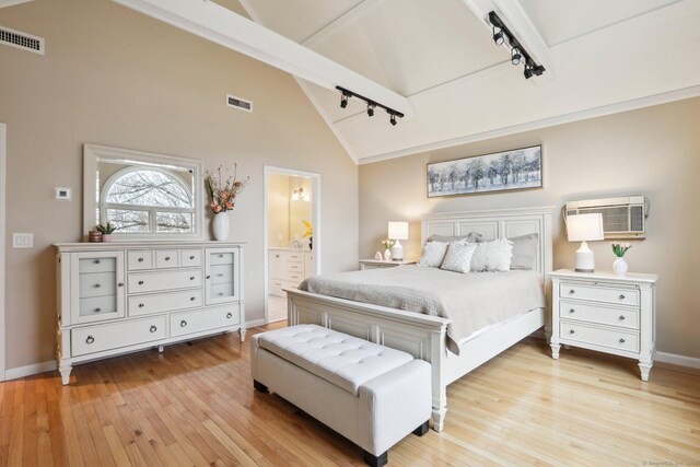 8 Grants Ln, New Milford, CT 06776 - bedroom featuring rail lighting, light wood-style floors, a wall unit AC, and baseboards