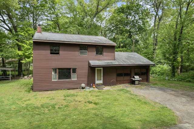 11 Glover Ave, Old Lyme, CT 06371 - view of front of house featuring a garage, a front yard, a chimney, asphalt driveway, and roof with shingles