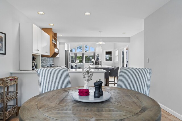 410 Noank Rd, Groton, CT 06355 - dining space featuring light wood-style floors, recessed lighting, and baseboards