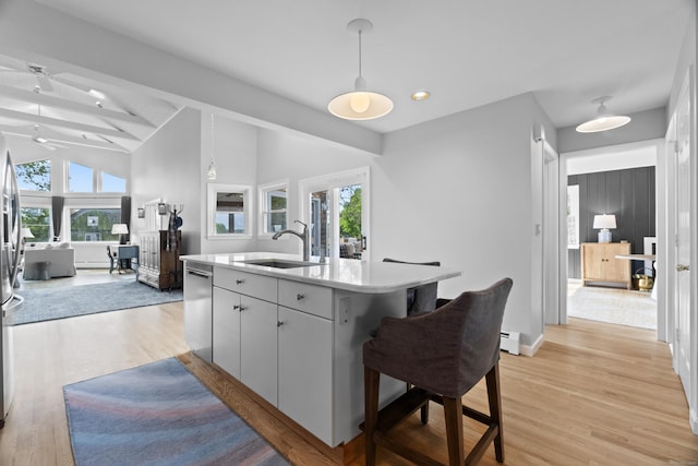 410 Noank Rd, Groton, CT 06355 - kitchen with a sink, appliances with stainless steel finishes, light wood-style flooring, open floor plan, and light countertops