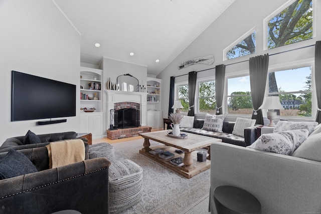 410 Noank Rd, Groton, CT 06355 - living area with high vaulted ceiling, a brick fireplace, recessed lighting, and built in features