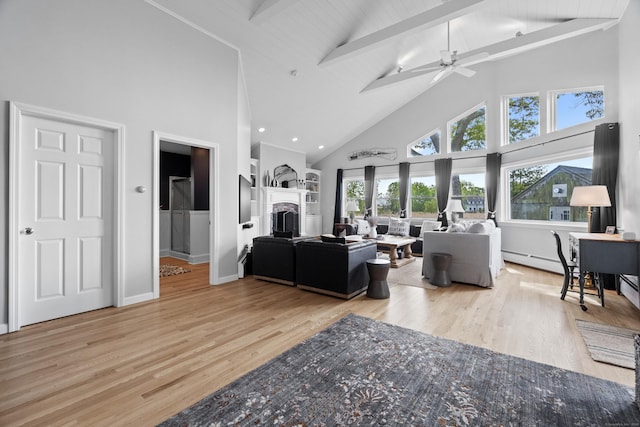 410 Noank Rd, Groton, CT 06355 - living room featuring high vaulted ceiling, a fireplace, beamed ceiling, wood finished floors, and ceiling fan