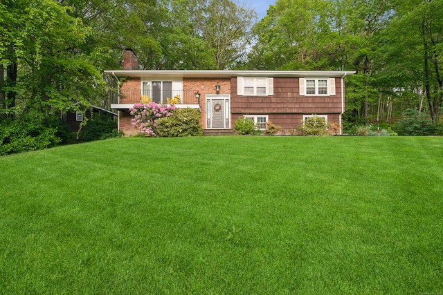 14 Button Rd, Shelton, CT 06484 - bi-level home featuring a chimney and a front lawn