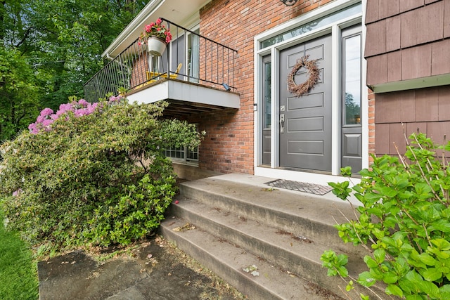 14 Button Rd, Shelton, CT 06484 - view of exterior entry featuring brick siding and a balcony
