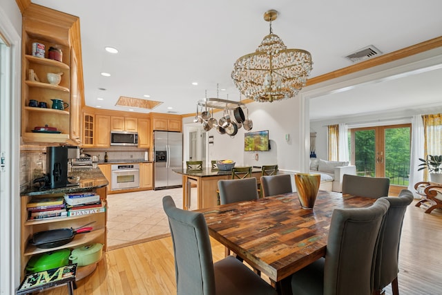 14 Button Rd, Shelton, CT 06484 - dining space with a chandelier, light wood finished floors, recessed lighting, crown molding, and a skylight