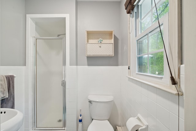 14 Button Rd, Shelton, CT 06484 - bathroom featuring tile walls, a stall shower, wainscoting, and toilet