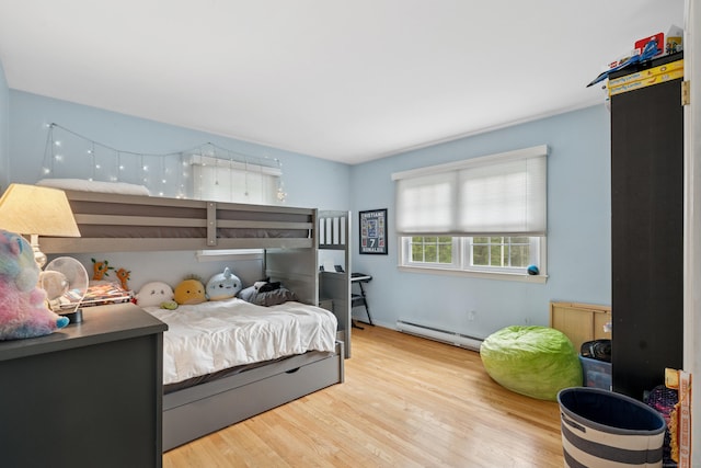 14 Button Rd, Shelton, CT 06484 - bedroom with a baseboard heating unit and wood finished floors