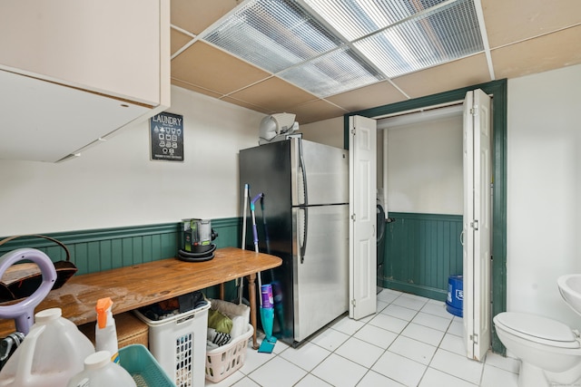 14 Button Rd, Shelton, CT 06484 - kitchen featuring freestanding refrigerator, a wainscoted wall, and light tile patterned floors