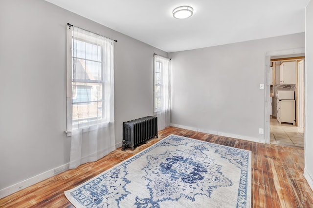 56 Gem Ave, Bridgeport, CT 06606 - spare room featuring radiator heating unit, hardwood / wood-style floors, and baseboards