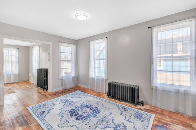 56 Gem Ave, Bridgeport, CT 06606 - interior space featuring radiator, wood finished floors, and baseboards