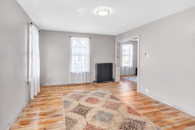 56 Gem Ave, Bridgeport, CT 06606 - spare room featuring radiator, light wood finished floors, and baseboards