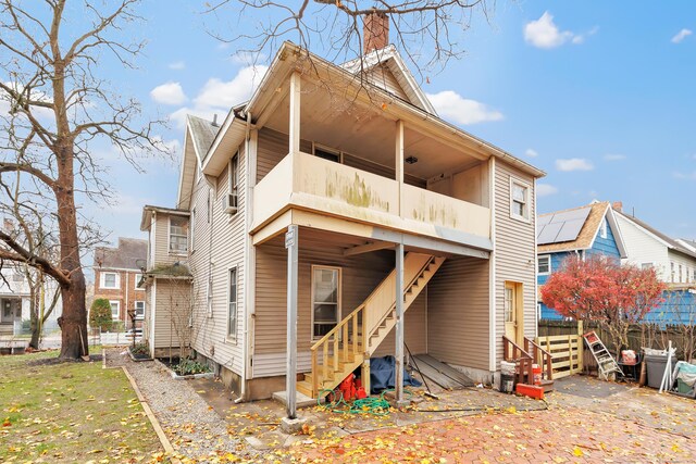 56 Gem Ave, Bridgeport, CT 06606 - rear view of house with stairs, a chimney, a balcony, and fence