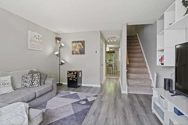 273 Derby Ave Unit 804, Derby, CT 06418 - living room with stairs, wood finished floors, baseboards, and ceiling fan