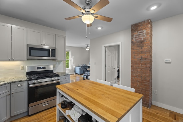 52 Edwards St, New Haven, CT 06511 - kitchen with stainless steel appliances, gray cabinetry, a ceiling fan, butcher block counters, and recessed lighting