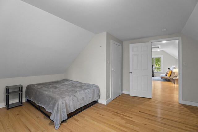 52 Edwards St, New Haven, CT 06511 - bedroom with vaulted ceiling, light wood finished floors, and baseboards