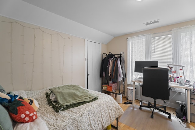 52 Edwards St, New Haven, CT 06511 - bedroom with wood finished floors, an office area, and lofted ceiling
