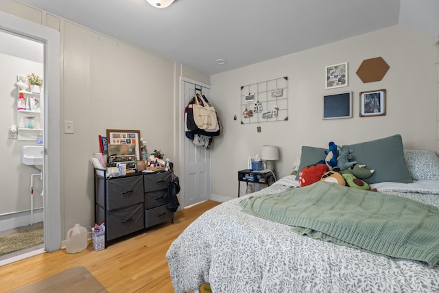 52 Edwards St, New Haven, CT 06511 - bedroom with wood finished floors, a closet, and baseboards
