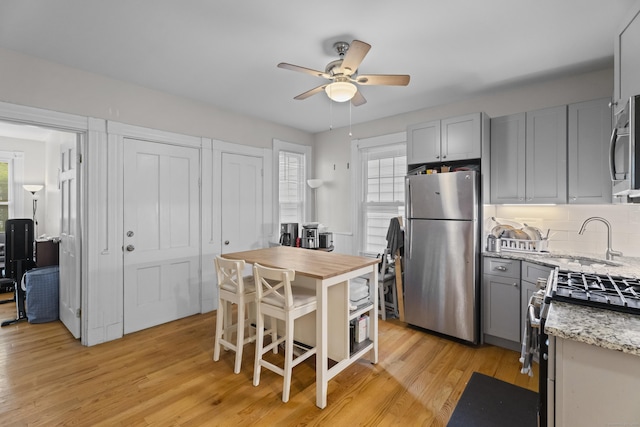 52 Edwards St, New Haven, CT 06511 - kitchen with stainless steel appliances, a sink, gray cabinetry, and healthy amount of natural light