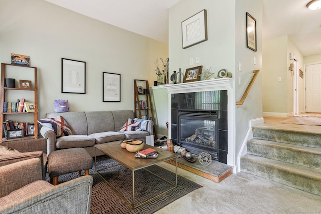 18 Cherokee Ct Unit 18, Cromwell, CT 06416 - carpeted living area with a tiled fireplace, stairs, and baseboards
