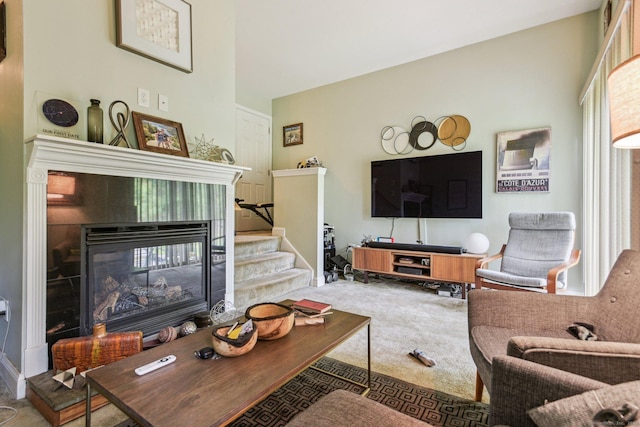 18 Cherokee Ct Unit 18, Cromwell, CT 06416 - living room with carpet floors, a tile fireplace, stairway, and baseboards