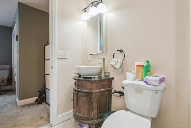 18 Cherokee Ct Unit 18, Cromwell, CT 06416 - half bathroom with baseboards, toilet, and vanity